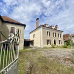 Imposing former farm at the heart of a charming village