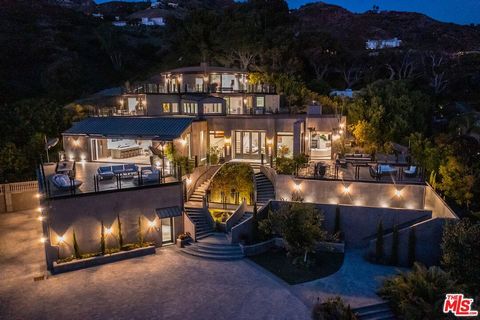 Discover the ultimate in elegance and tranquility in this ultra-private gated Malibu compound situated on over 7 acres with private access to Lechuza beach and endless sunrise-to-sunset ocean views. Enter through the private front gate to the long dr...