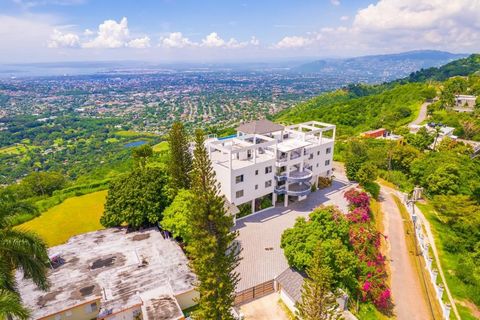 Nestled in the cool hills of Skyline drive is this 2 bed 2 bath apartment just waiting for the perfect buyer who will create a wonder with the great bones that it already possesses. The views from every window are terrific. Jamaica's Blue Mountains a...