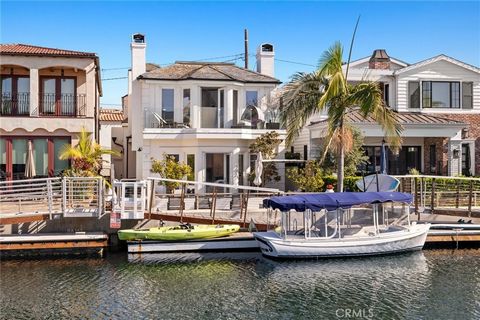 Your opportunity to own the water front lifestyle at a significant savings. Live the true coastal lifestyle from this stunning water front home nestled on storied Naples Island. Recently re-built with an attention to both aesthetic design and comfort...