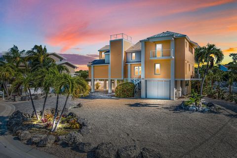 Modern and spacious home in prestigious Venetian Shores offering 4 bedrooms and 3.5 bathrooms, CBS construction with a metal roof. The property includes a 60' concrete dock complete with a 15,000lb boat lift. The main level features a galley kitchen,...
