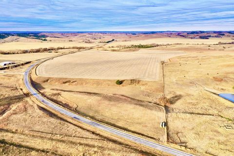 This is a fantastic opportunity to acquire 102.02 +/- acres situated along a well-maintained blacktop road. The property features a combination of productive dryland farm ground and lush grassland, making it ideal for agricultural activities, livesto...