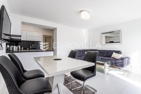 Trogir, modern one-bedroom apartment in a newly built building, available for rent all year round. The apartment is located on the second floor of the building, and is divided into a hallway, bathroom, bedroom, kitchen with dining room, living room a...