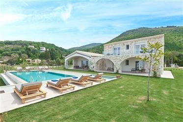 Amazing 6 Bedroom Villa with spectacular sea views in Corfu. Newly built amazing stone Villa with modern, elegant architecture situated in the beautiful, peaceful beach area of Apraos, Corfu. The interior is luxurious and spacious while the outside o...