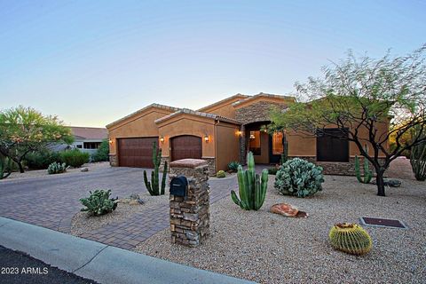 PRICED BELOW APPRAISAL!! Hidden gem awaits you when you pull up to this stunning custom home with views to die for, A high-performing, energy-efficient home is meticulously cared for by one owner and is a PEARL Certified Gold Home. Desert landscaping...