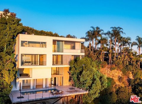 Welcome to a contemporary marvel in the heart of the Hollywood Hills, where panoramic views steal the spotlight. This modern retreat recently went through a million dollar renovation creating an atmosphere of absolute luxury. Upon entry, the soaring ...