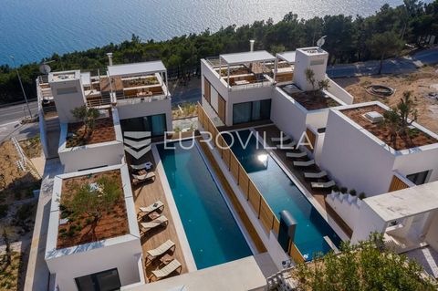 Not far from Omiš, there are two mirror-imposing villas on a plot of 2253 m2. They extend over three floors and together have 595 m2 of net usable area. Ground floor Each villa has covered parking with three parking spaces and a charging station for ...