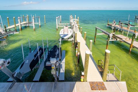 New, concrete construction, concrete roof, 3 boat lifts, large 30k, medium 15k and jet ski 7k, 35 ft of brand-new concrete seawall, SELLER FINANCING AVAILABLE, VIEWS, VIEWS, VIEWS, direct gulf, open water exposure, open concept living areas, tons of ...