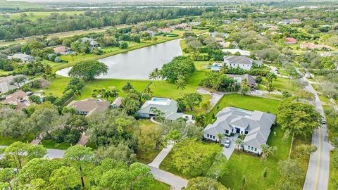 Nestled on a premium Steeplechase lot, this residence offers an expansive lake view on over an acre of land. Featuring generously sized rooms, large bright kitchen, screened patio and a private pool.