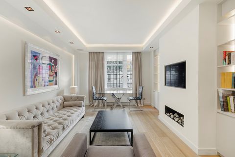 This bright and modern two-bedroom apartment is located on the highly coveted Portland Place. It unfolds over the raised ground floor of an impressive apartment building situated on one of London’s most sought-after residential streets. The reception...