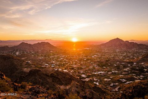 Undoubtedly the most spectacular view lot left for sale in coveted Clearwater Hills. This 11+ acre lot perched atop the highest peak in Paradise Valley offers unparalleled panoramic views that stretch across the iconic Arizona landscape. From the van...