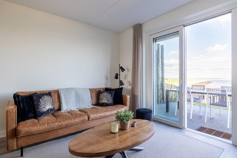 Wake up to breathtaking views of the harbor and Eastern Scheldt in this stunning apartment in Sint-Annaland. Boasting panoramic vistas, this spacious and luxurious accommodation offers the perfect combination of comfort, tranquility, and modern ameni...