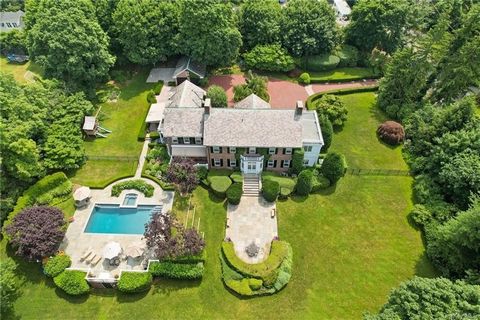 Unparalleled elegance in this 6-bedroom brick Georgian Colonial, reminiscent of an English estate on rare 1.5 private & picturesque property. A long private drive bordered by flowering shrubs, beautiful circular entrance w/ artistically landscaped me...