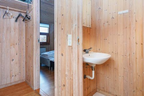 A well-kept holiday cottage with spa and sauna in one of the bathrooms. The house is located on a secluded plot close to forest and beach. High-beamed ceiling. A large, open kitchen / living room where everyone in the family can gather. Lowered livin...