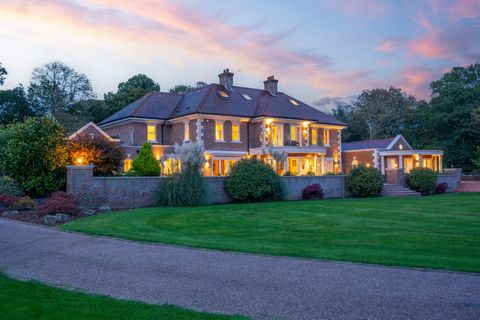 Nestled within five acres of meticulously landscaped and wooded grounds, this stunning traditional home offers an unparalleled blend of elegance and natural beauty. The exterior boasts classic architecture, with a charming facade adorned with large, ...