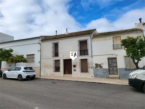 This townhouse is located in the pretty town of Lora de Estepa close to the local amenities the town has to offer. The property opens in to a central hallway that leads to two ground floor bedrooms to the front of the property and a large lounge dine...