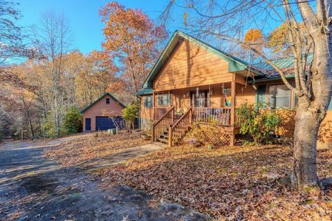 Escape to your mountain haven with this stunning 4-bedroom cabin, nestled on over 3 sprawling acres of scenic beauty. This property offers breathtaking views of rolling pastures and majestic mountain landscapes. Located on a paved road leading to the...