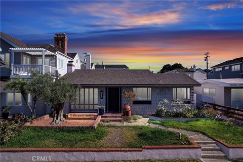 A rare opportunity in the heart of Corona del Mar's Village—310 Marigold Avenue sits on an oversized 5,310 sq ft lot with 45 feet of frontage, and includes approved plans to build a stunning ~ approximately 4,400 sq ft custom home by acclaimed Newpor...