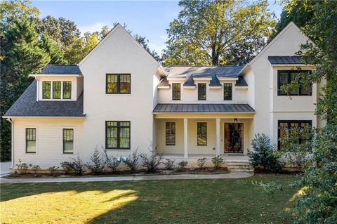 Sensational new construction in the most coveted part of Buckhead with designer selections and a remarkable attention to detail to satisfy today's most discerning buyer! A large covered front porch with an iron and glass front door greets your guests...
