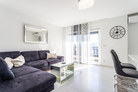 Trogir, modern one-bedroom apartment in a newly built building, available for rent all year round. The apartment is located on the first floor of the building, and is divided into a hallway, bathroom, bedroom, kitchen with dining room, living room an...