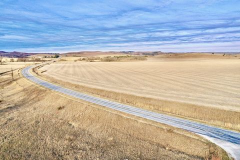 This is a fantastic opportunity to acquire 102.02 +/- acres situated along a well-maintained blacktop road. The property features a combination of productive dryland farm ground and lush grassland, making it ideal for agricultural activities, livesto...