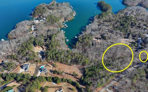 Come build your dream lake home on quiet cove and private street. Short distance to Aqualand Marina in desirable Flowery Branch. Potential for Slab or Basement home. Close to main channel of Lake Lanier. No HOA and Seller does not have Dock Permit. P...