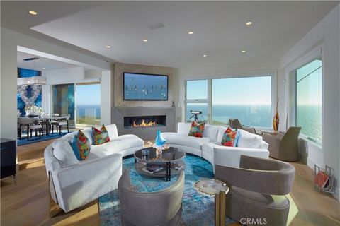 Perched atop Dana Point's historic Headlands, Residence B immerses you in unmatched ocean vistas from San Diego to Palos Verdes, blending modern luxuries with coastal elegance. This home stands apart due to a major remodel in 2017 and subsequent upgr...