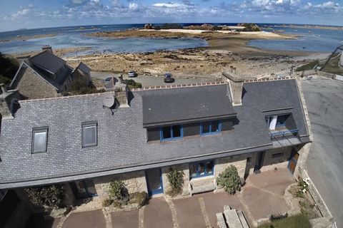 Situated on the Pink Granite Coast, this typical Breton holiday home offers a fantastic sea view from the living area and from almost every room. At the rear of the long building, a sheltered terrace lined with hydrangeas offers space to sunbathe and...