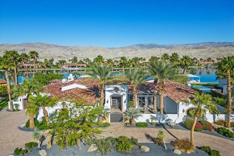 Welcome to Shadow Lake Estates, a haven of luxury living nestled just 20 minutes from Palm Springs. This opulent lakefront property spans 2/3 acre, featuring a private beach, boat dock, and covered lift overlooking the pristine 45-acre Shadow Lake--a...