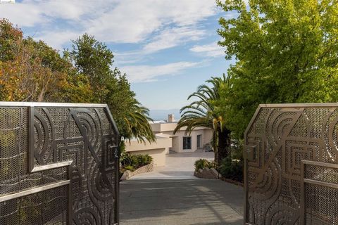 Just beyond the private gates sits this iconic, single story, custom-designed property atop the Ridgemont hills on over 3 acres of land. The non-traditional but practical architectural design of this property make it versatile for large events or pri...