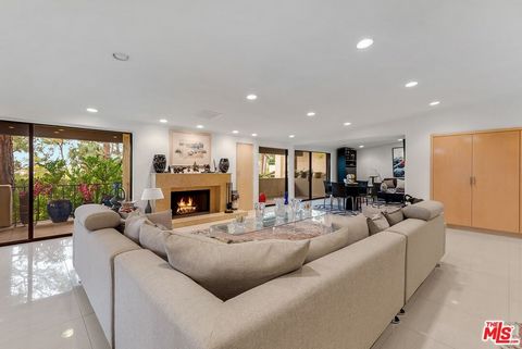 Exquisitely renovated stunning one-level 3 bedroom, 5.5 baths, 4,908 sf, rarely found in highly sought after Century Woods secret oasis behind guard-gates. Designed by Cliff May, this low rise building offers complete privacy and inspiring West facin...