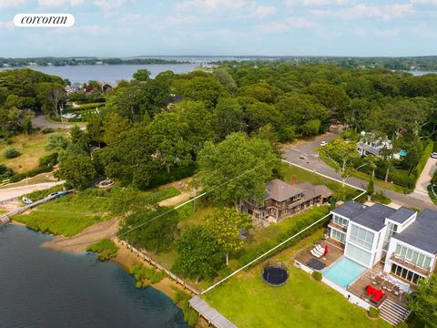 Looking for paradise? This stunning west-facing waterfront property on 1/3 acre boasts unobstructed sunset views that will leave you speechless. With 90' of bulkheaded waterfront on Sag Harbor Cove, you could even have a private dock. The 4 bed, 3 ba...
