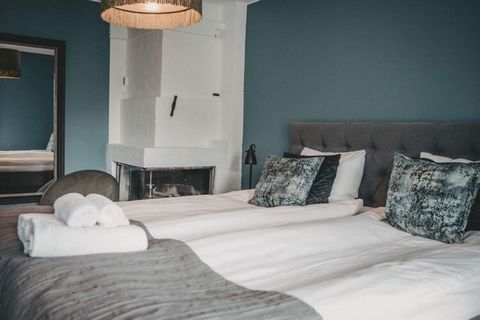 This room in a hotel has stylish new superior double rooms offer a luxurious retreat featuring a king-size double bed and a chic bathroom inspired by the treetops. Each room is thoughtfully designed in its signature colors, showcasing comfortable arm...