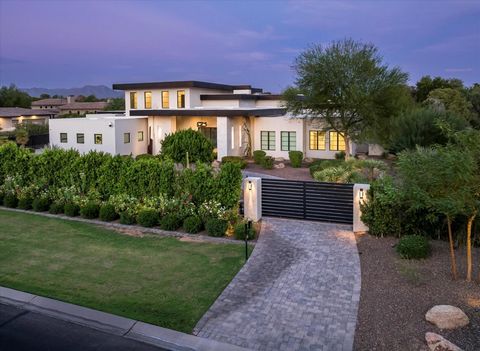 Welcome to this privately gated modern luxury estate, set on 1+ acres in the heart of Paradise Valley. Designed for the discerning buyer, this residence offers expansive ceilings and abundance of natural light throughout. Featuring a 30'+ pocket door...