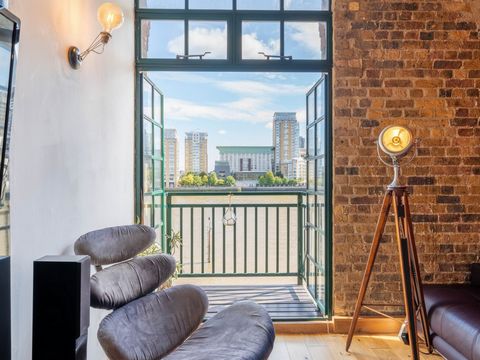 Flat 33 is a stunning apartment situated in the iconic Grade II-listed Canada Wharf, a former Victorian warehouse on the banks of The River Thames. Spanning over 1,000 sq/ft and located on the fourth floor, this exceptional property with ceiling heig...