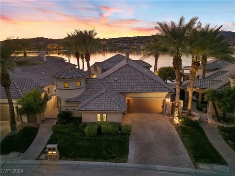 Experience breathtaking views from this lakefront retreat in the guard-gated SouthShore community at Lake Las Vegas. The open-concept design offers a spacious living, kitchen, and breakfast area; all with expansive windows that capture stunning lake ...