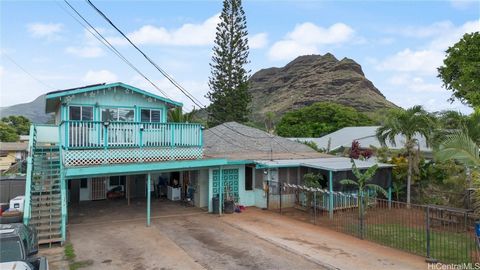 This spacious 4-bedroom 3-bathroom home is situated in the coveted area of Maili boosting an enviable location right across the street from the beach. Enjoy the charm of this coastal home while you sit on your 20x20 square foot lanai up stairs and em...