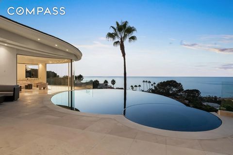 Mesmerizing and unobstructed views will amaze and delight in this recently and completely reimagined showstopper. With masterful precision, the home’s harmonious curvilinear design artfully reflects the soft arcs and bends of the coastline and sea. I...