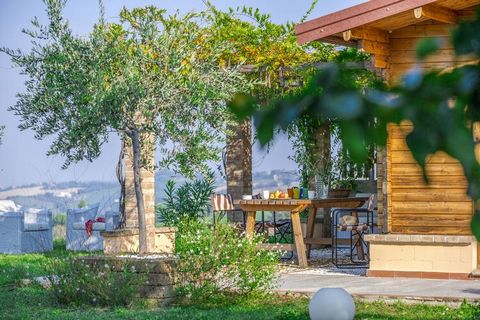 The flowered pergola, the table for outdoor dining, the comfortable sofas and the garden from which you do not get tired of enjoying the wonderful view of hills to the sea, give personality to this lovely cottage located just 17 km from the beaches o...
