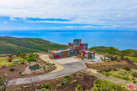 Perched high above Western Malibu sits this appox. 3,300 sq. ft. home. Includes a separate 15 acre flat building pad w/Certificate of Compliance. This dramatic architectural residence is awash with natural light, large windows and wraparound decks, i...