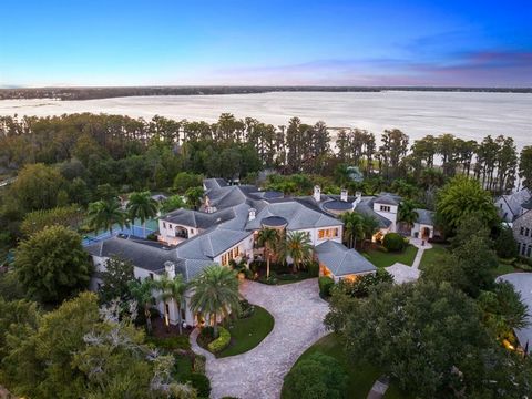 Welcome to 6004 Cartmel Lane, a truly magnificent lakefront estate in highly coveted Windermere, Central Florida. Nestled on the pristine shores of Lake Butler (largest on the Butler Chain of Lakes) and ideally situated on a secluded cul-de-sac withi...