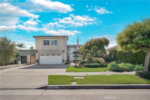 Enjoy the quintessential California Lifestyle in Huntington Harbour. This spacious and contemporary estate boasts over 3,400 sq. ft. of living space, featuring 5 bedrooms, 3 bathrooms, and a versatile loft/office. The fifth bedroom, currently utilize...