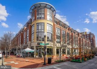 Welcome to your dream home in the heart of Carlyle, Old Town Alexandria! This stunning first-floor loft-style condo features an abundance of natural light with floor-to-ceiling windows, soaring ceilings, and an open-concept layout perfect for both re...