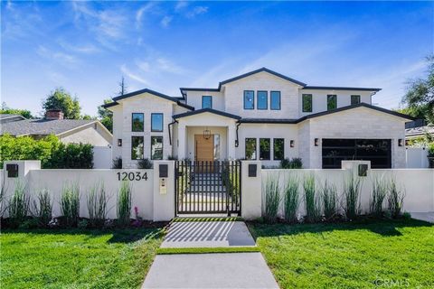 Gorgeous, new transitional home with modern touches and warm wood finishes on a large, gated lot in prime Valley Village. Featuring 5 BR - 6.5 BA in home and detached rec room/cabana (covered patio) in approx. 5,100 sqft on an over 10,000 sqft lot, w...