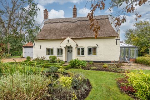 The quintessential country cottage, with its thatched roof and pretty porch, all set in lush green surroundings down a quiet country lane – this is a place with huge kerb appeal. But there’s much more here than first meets the eye. It’s a surprisingl...