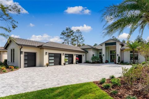 FULLY FURNISHED! Welcome to this stunning contemporary masterpiece that seamlessly blends luxury living with natural beauty. As you step through the expansive double doors, you are greeted by an open great room that offers a captivating view of the c...