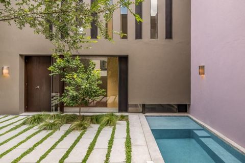 This exquisite home, designed by renowned architect Luis Sanchez Renero, seamlessly blends modern minimalism with natural beauty. The clean walls, double-height living and dining room ceiling, and spacious kitchen create a harmonious living space. Th...