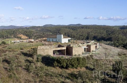Discover the perfect getaway among the hills of Aljezur, where serenity meets modernity. We present this unique opportunity to acquire a stunning estate, located just 2 km from Aljezur, with a generous extension of 23.55 hectares, and with a construc...