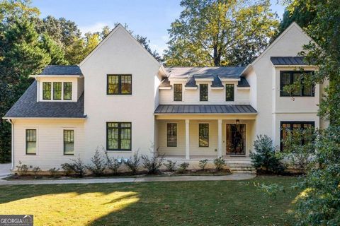 Sensational new construction in the most coveted part of Buckhead with designer selections and a remarkable attention to detail to satisfy today's most discerning buyer! A large covered front porch with an iron and glass front door greets your guests...