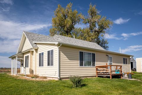 Located in Sterling, Colorado, this charming 3-bedroom, 1-bathroom home sits on a generous 3.97 +/- acres off County Road 36. Recent exterior enhancements elevate its appeal, while the property boasts a steel-sided garage and a spacious pole barn-per...